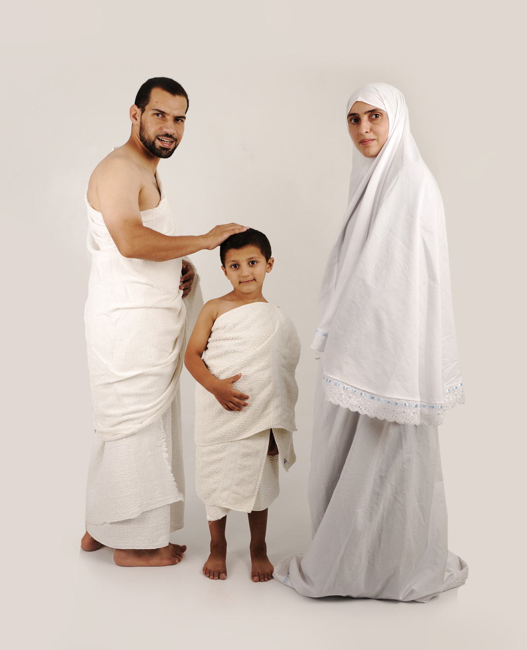 Muslim pilgrims in white traditional clothes